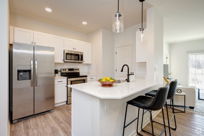 Floor Plan A - 2 BR, 2 BA - 1100 SF. Kitchen and dining room.