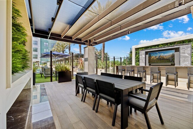 Elevated green space with outdoor fireplace and cozy seating - Hanover Winchester