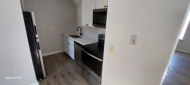 Building Photo - Menard Apartments Unit 2359 A