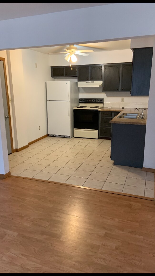 Kitchen with tile flooring - 20427 W Clark Ave Unit Apt 2