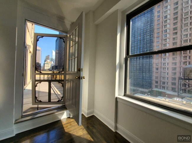 Building Photo - 145 W 55th St Unit 13A Rental