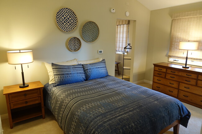 Bedroom with queen size platform bed and 10-drawer dresser - 2620 Tallant Rd Unit Guest House