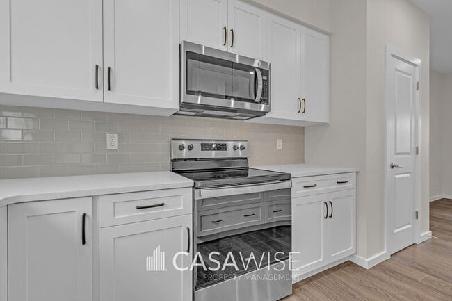 Photo - 21107-21125 25 Ave NW