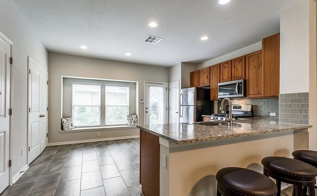 Photo - 2-bed 2.5-bath home with detached 2-car garage with EV charger