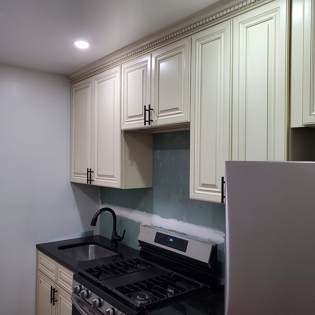 Kitchen, backsplash to be installed. New appliances - 4204 Foster Ave Townhome