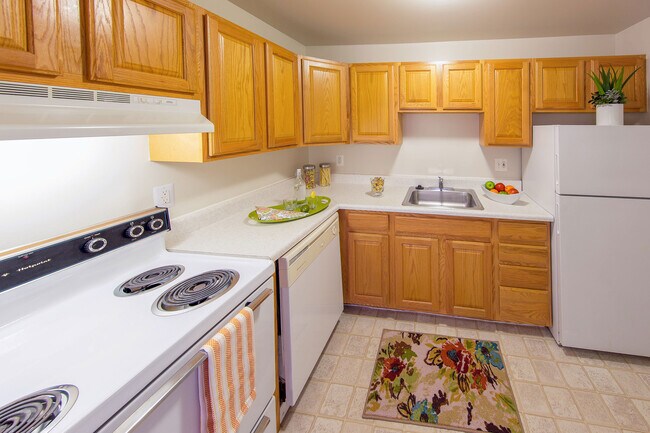 Kitchen (cabinets & appliances vary) - Medical Center Court Rental
