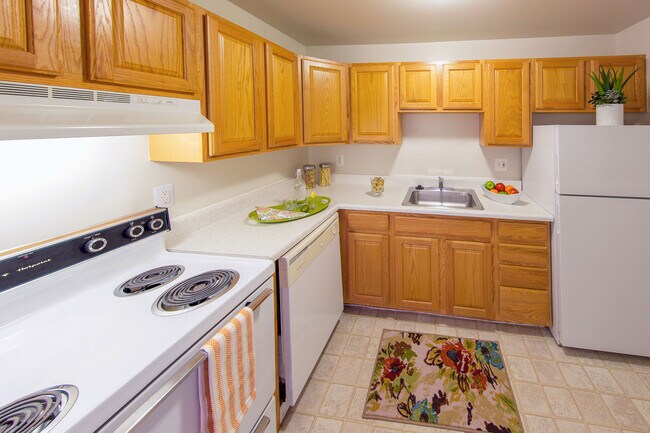 Kitchen (cabinets & appliances vary) - Medical Center Court Apartments