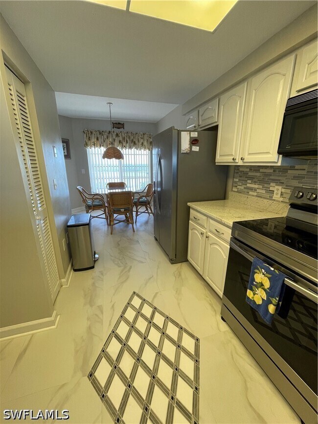 Building Photo - 13105 Vanderbilt Dr Unit 808