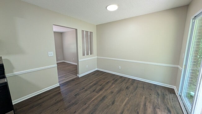 Photo - Fenced Yard, Lots of Light, Hard Floors Throughout
