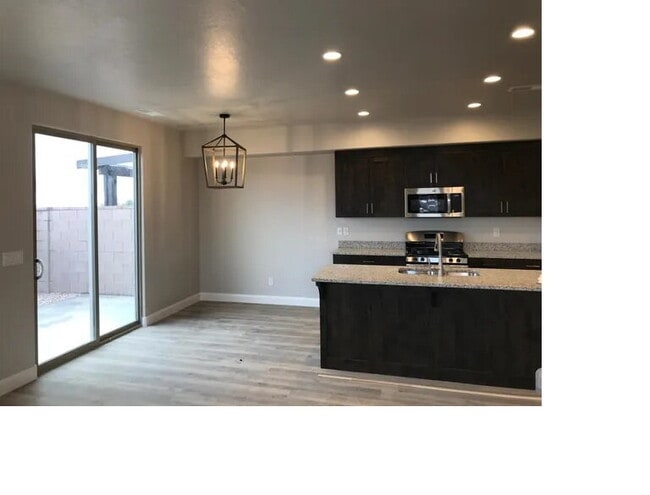 Photo - "Spacious 4-Bedroom Townhouse Oasis in Hur... Unit 128