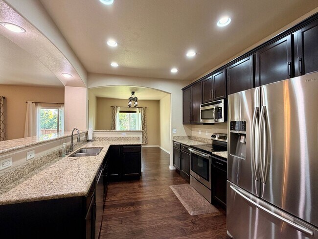 Photo - GRAND Liberty Ranch Home | 5 Bedrooms | Finished Basement + Bar | 3-Car Tandem Heated Garage | Pr...