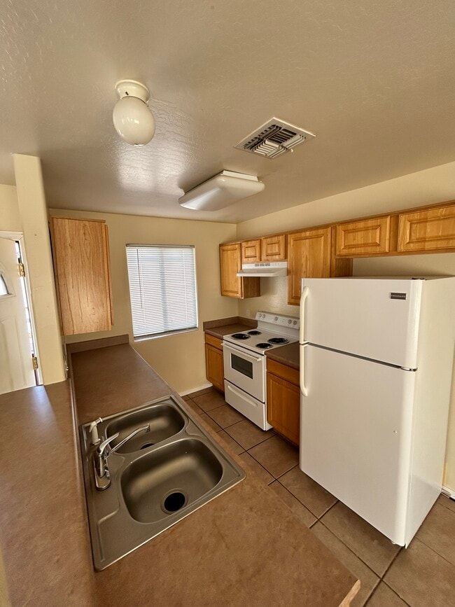 Building Photo - 8550 W Monaco Blvd Unit C