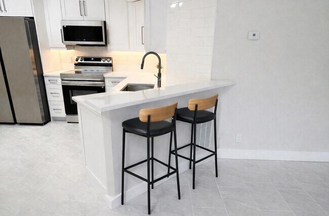 Photo - 9055 Wiles Rd Unidad 208