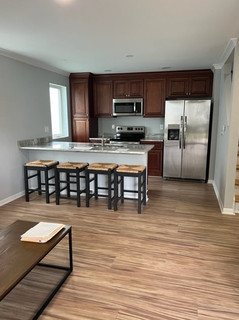 Kitchen with stainless steel appliances + quartz 9-foot countertop