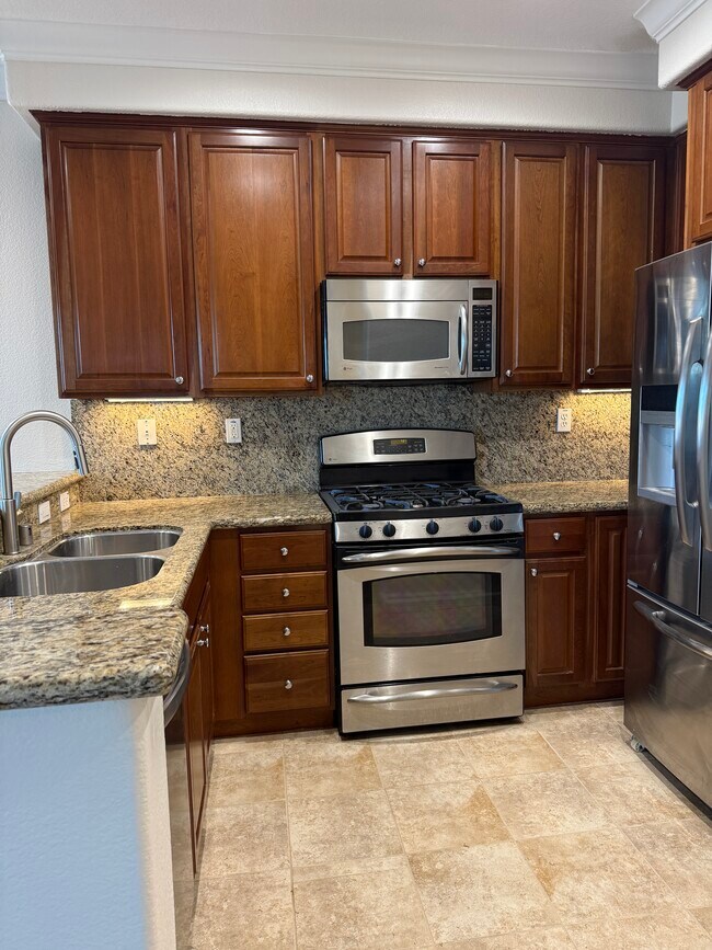 Granite countertops and stainless steel appliances - 1307 De Altura Cmn Unit 1307 De Altura Commons