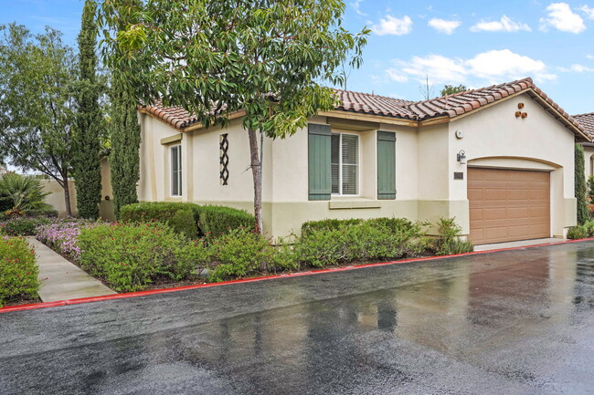 lush gardens surround the home - 4720 E Washington Ave House