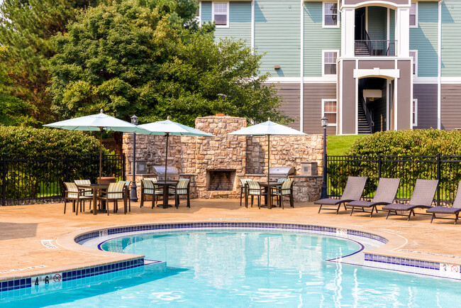 Sparkling Pool and Grill Area - The Pointe at State College Apartments