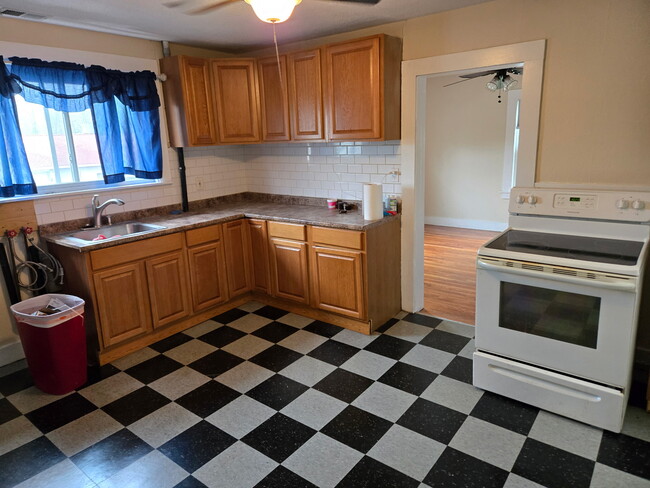 Eat in kitchen with large pantry and stack washer dryer - 119 Main St Apartment Unit #4
