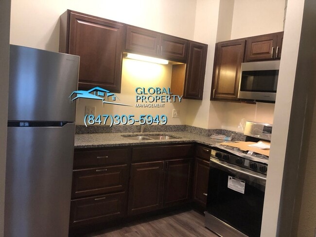 Building Photo - 6313 27th Ave Unit 1