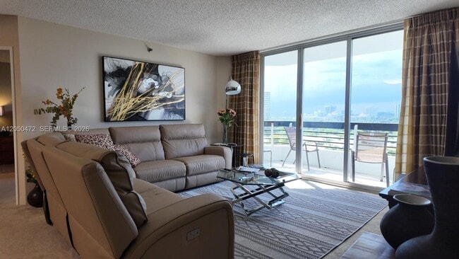 Building Photo - 3600 Mystic Pointe Dr Unit 1111