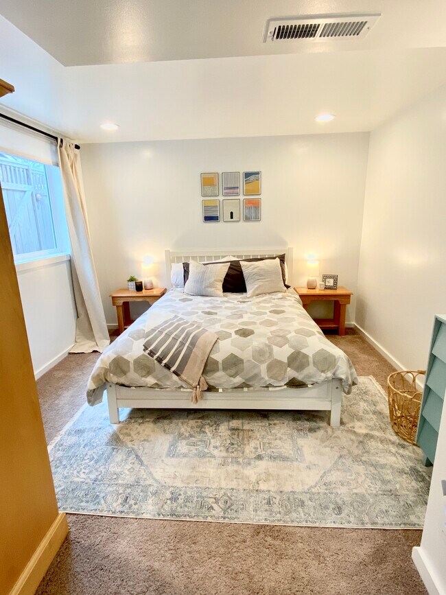 Bedroom with queen size bed. - 4045 54th Ave SW Unit 1 Genesee Gem
