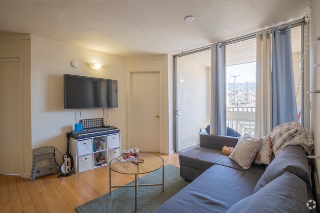 4BR, 1BA - 1000 SF - Living Room - Channing Campus Apartments