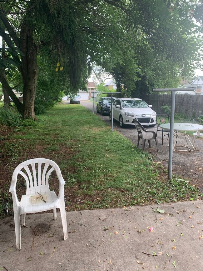 Yard. Patio area. Driveway. Parking in rear. - 321 Lincoln Way W Unit 2nd Floor