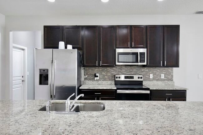 Photo - Stylish 4/3 Home with Covered Patio & Gara...