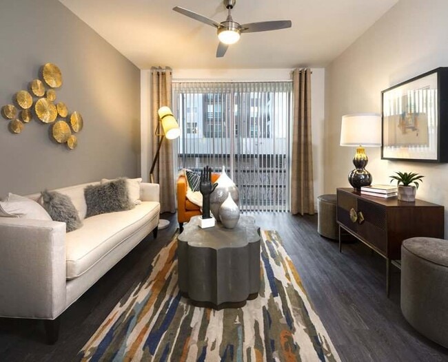 Living room with faux wood flooring - The Grand at Legacy West