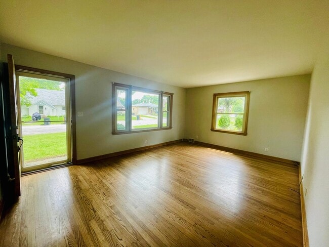 Living Room with hardwood floors and picture window - 523 N 107th St