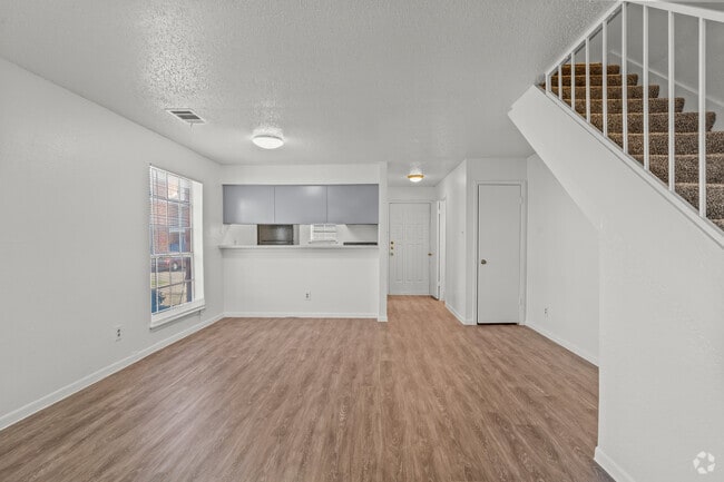 2BR, 2.5BA - 1045 SF - Living Room - Plantation West