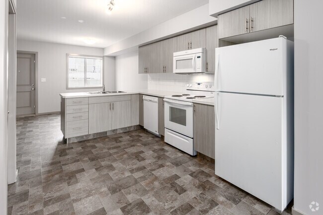 2 chambres, 3 salles de bain - 1132 pi² (+566 pi² au sous-sol) - - Belmont Village Townhomes