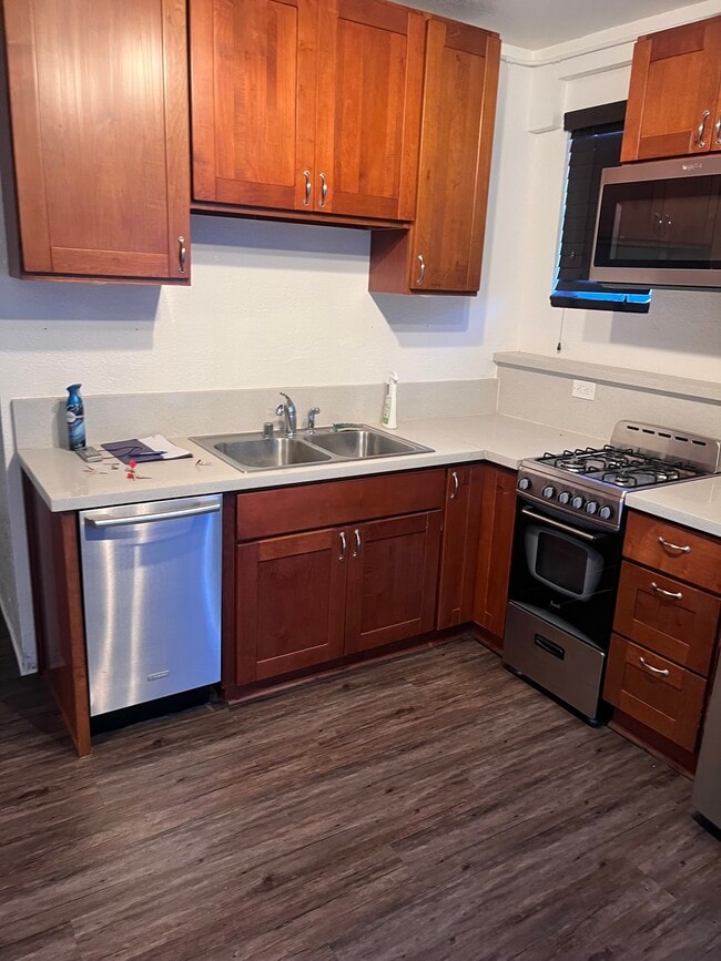 Kitchen with dishwasher, microwave, oven, fridge with ice maker - 708 Fruitvale Ave Apartments Unit 712