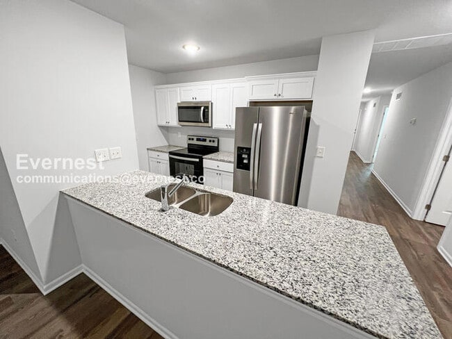 Photo - 4 Bed, 2 Bath Home with Garage / Pet-Friendly / Coming Soon!