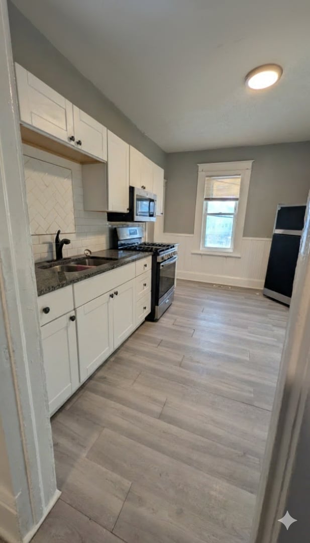 Photo - Come home to this great single family home with tons of charm and a beautiful yard