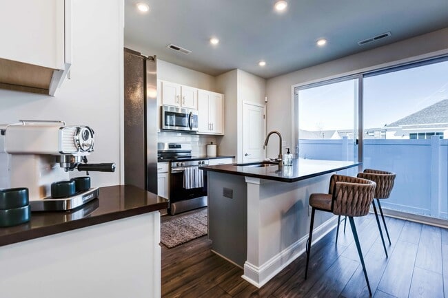 Discover the joy of spacious cooking in our cottage kitchens. Ample counter space awaits on your quartz countertops.