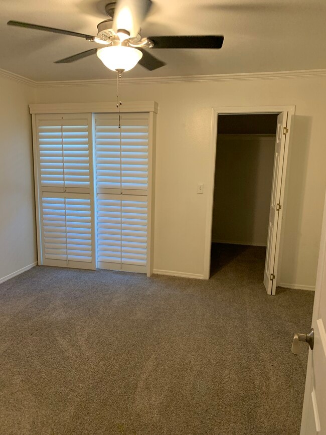 Bedroom with walk in closet and new double pane sliding glass doors to private balcony/deck - 436 N Bellflower Blvd Unidad 218 Rental