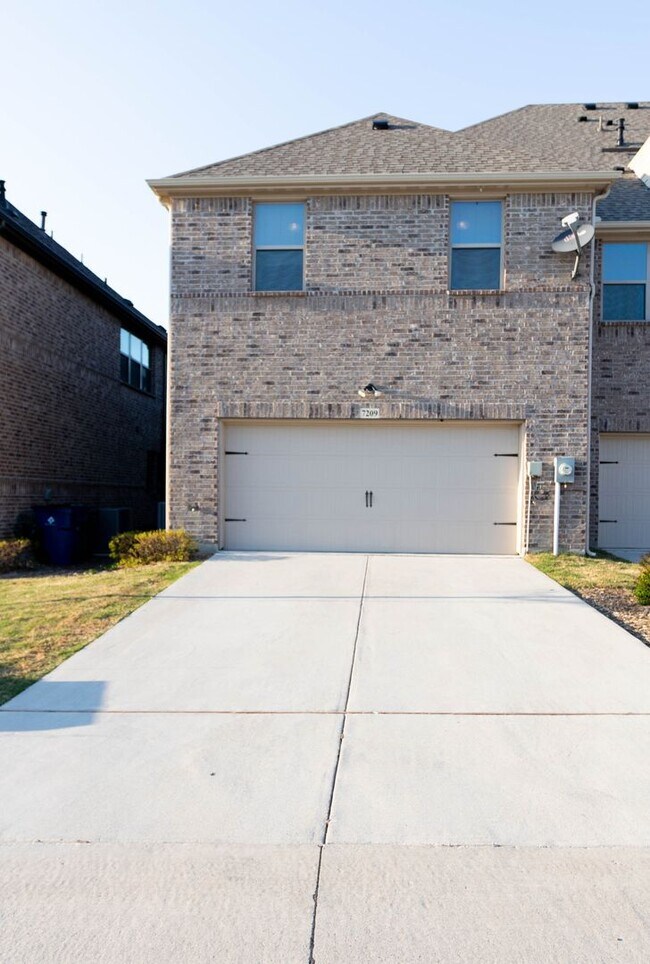 Photo - Two story townhome with 2 car garage on an...