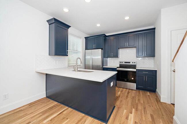 Redfield-Villages-Apartment-Homes-Near-NC-State-138-Faircloth-St-Luxury-Kitchen-Navy-Cabinetry