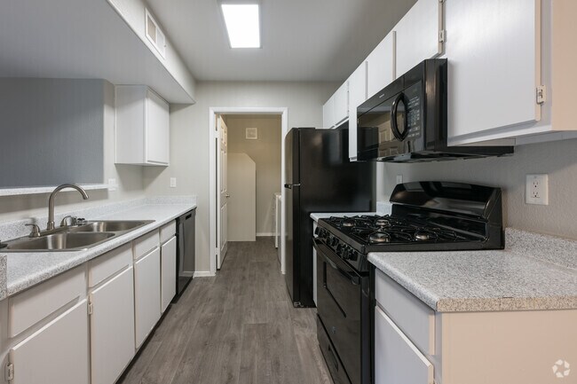 2BR, 2BA - 1010SF - Kitchen with laundry room at far end