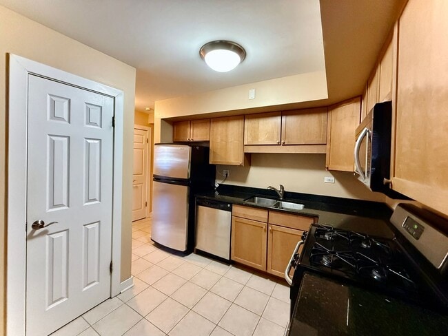 Photo - Pristine 2 Bedroom, 1 Bathroom Condo Available NOW! Heat, Water, & Parking INCLUDED in Rent! Unidad 1A