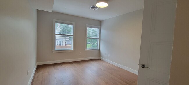Photo - Large 2bd/2bath with Garage parking! Steps to Commuter Rail!