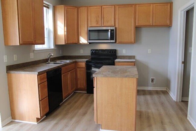 Photo - Modern 3-Story Townhouse Living with Garage