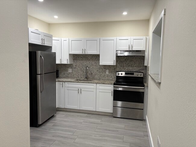 Full kitchen with all new appliances - extra cabinet space and pantry - 2385 SW 25th St Unit Apt - Silver Bluff-Gables
