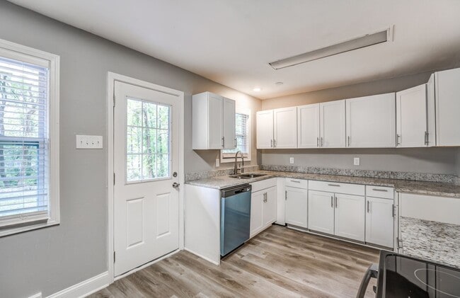 Photo - Charming 4-Bedroom, 3-Bath Single-Family H...