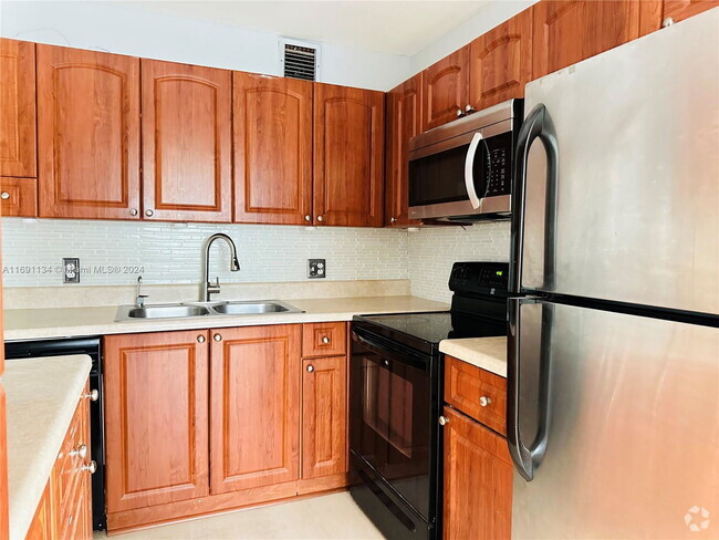 Building Photo - 1401 SW 134th Way Unit 309C Rental