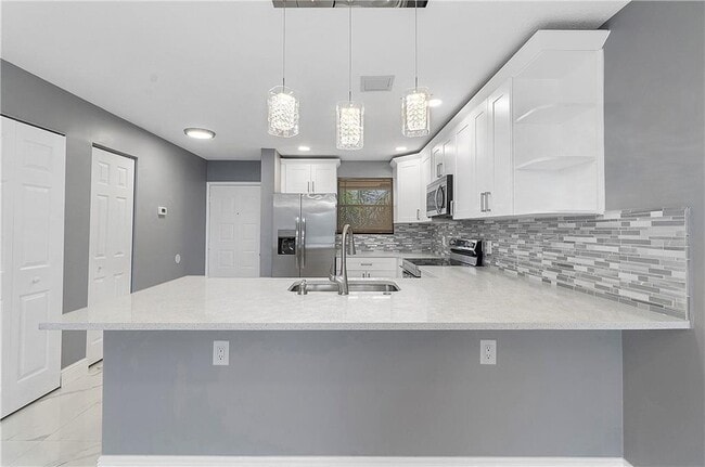 Building Photo - 11477 NW 39th Ct Unit 305-1