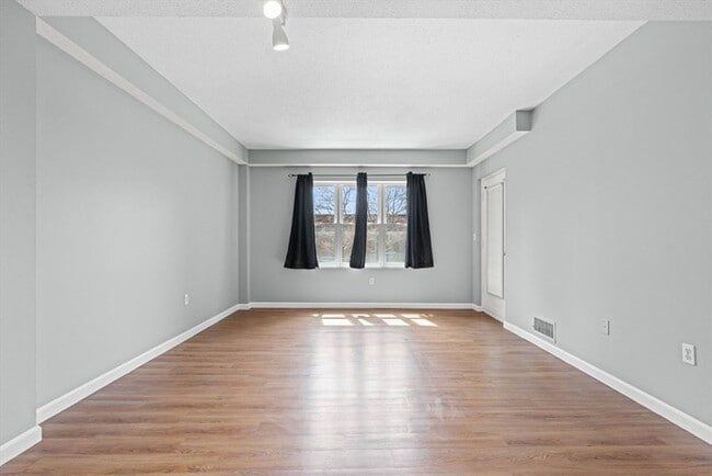 Photo - Updated 1BR Condo with Balcony, Garage Parking & Storage Near Commuter Rail Unit 101
