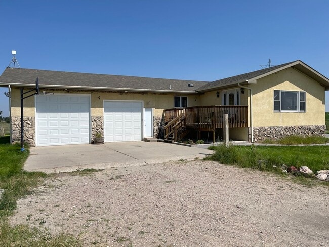 Building Photo - Spacious, four-bedroom, two-bathroom, coun...