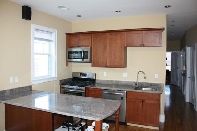 Photo - Renovated 5-Bedroom in Mission Hill | Central Air | In-Unit Laundry | 9/1